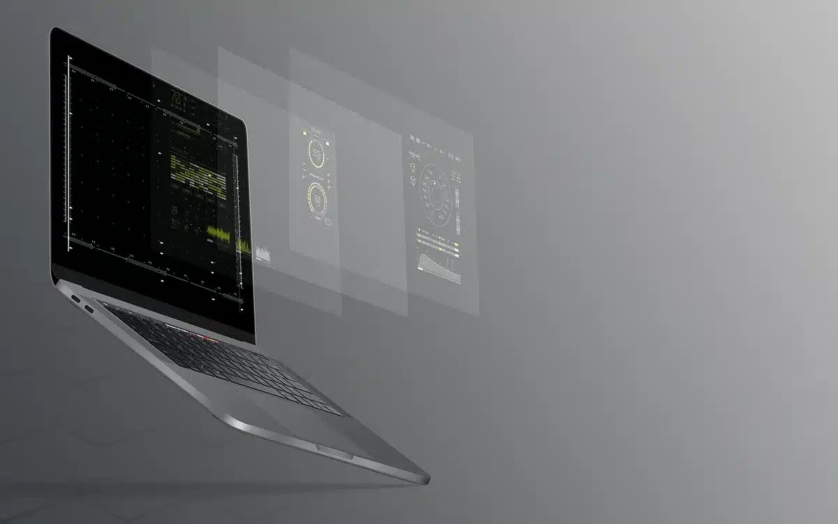 Hands over a laptop showing typing in a dim room, evoking anti-cheat enforcement