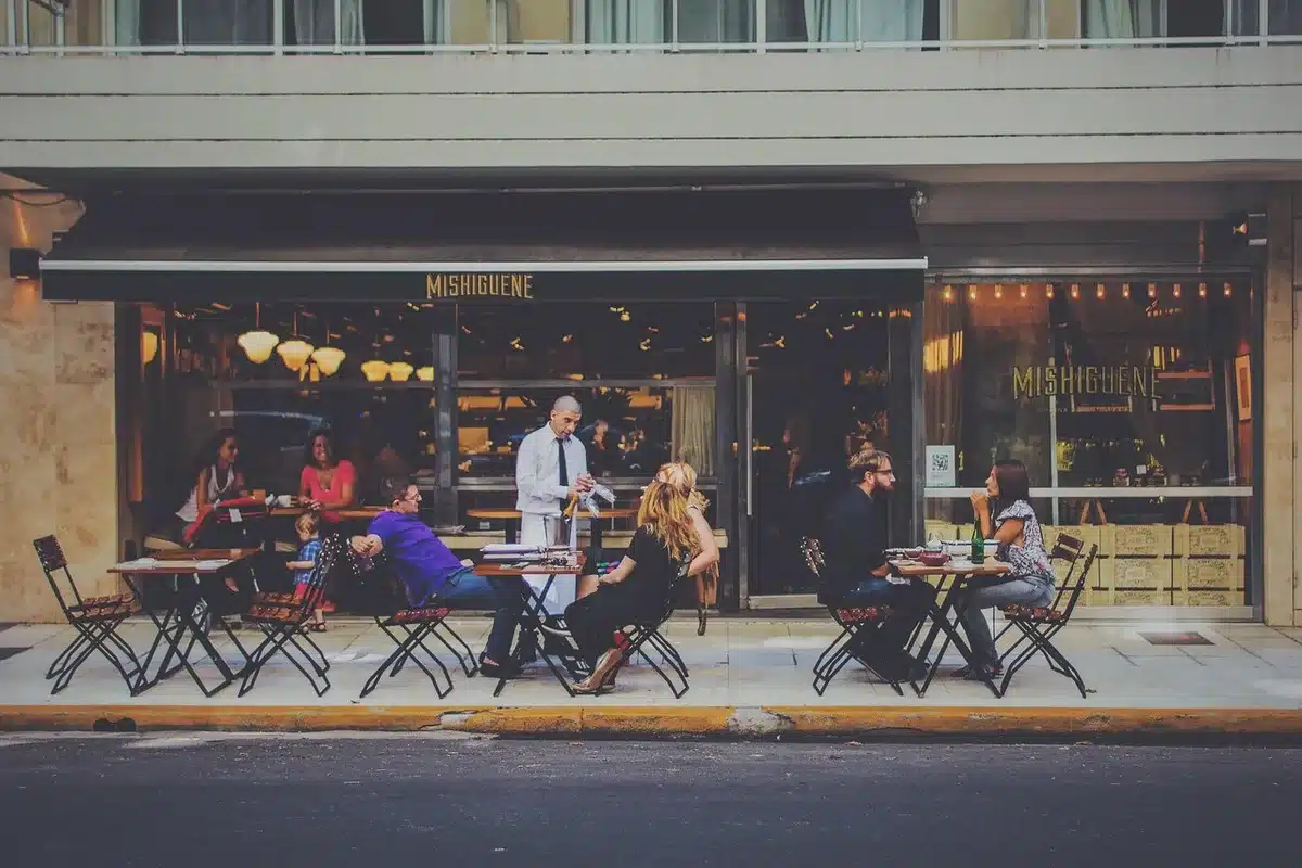 A diverse group of young friends laughing on a New York street