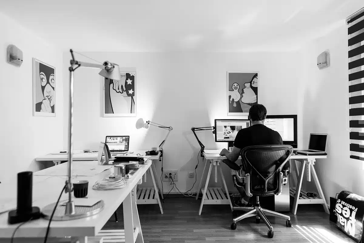Empty office with vacant desks and chairs in a game studio environment