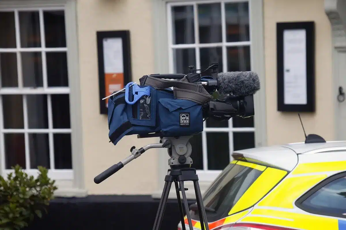 A behind-the-scenes production monitor showing a promotional TV clip being reviewed