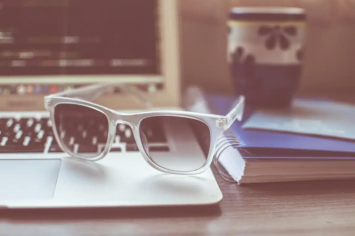 Writer at a desk with notebook and coffee, symbolizing the creator at work