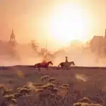 Silhouette of a lone rider on horseback crossing a sunlit western plain