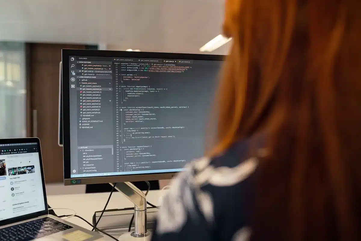 Empty developer office with monitors and game posters